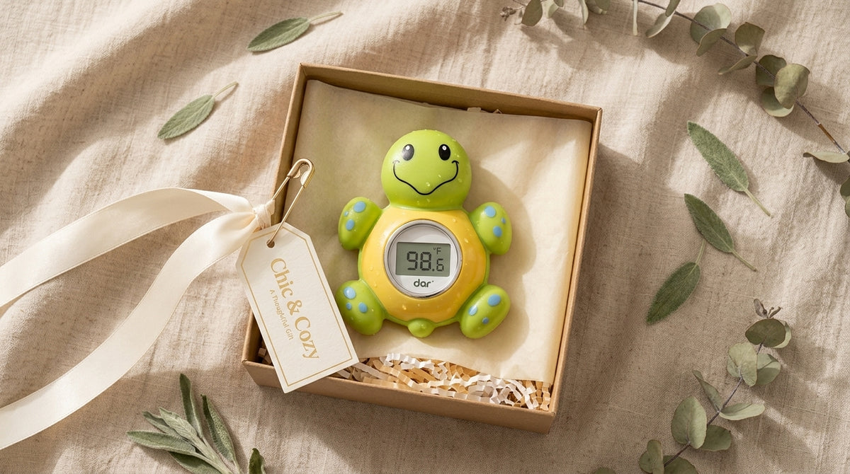 Green turtle-shaped floating digital baby bath thermometer displayed in a gift box
