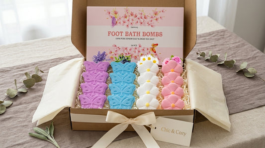 Gift box containing 16 colorful flower and butterfly foot bath bombs with cream ribbon